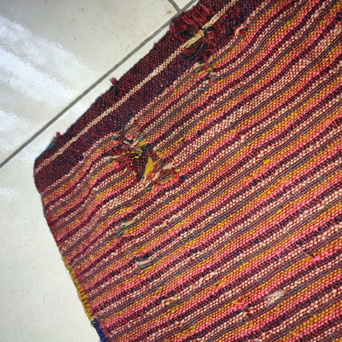 Old woven double horse saddle bag used with fabric tears