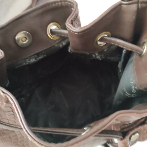 Brown bucket bag with shoulder and crossbody strap