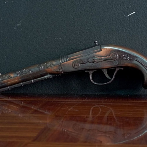 Vintage replica pistol used with engraved designs