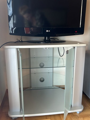 TV cabinet with LG TV, white, glass doors and shelves