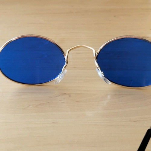 Oval sunglasses new with blue lenses and golden frames