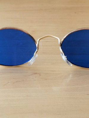 Oval sunglasses new with blue lenses and golden frames