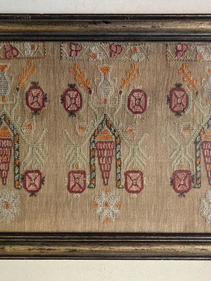 Vintage embroidery used with wooden frame and traditional pattern
