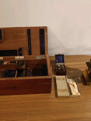 Vintage microscope used with accessories and wooden case