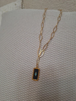 Gold-colored stainless steel necklace with extension