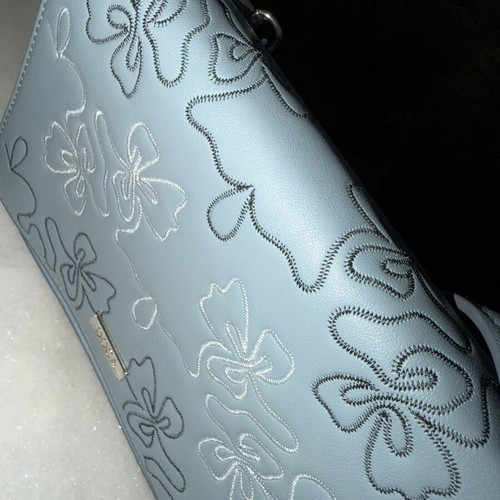 Doca crossbody bag like new, blue with embossed flower designs