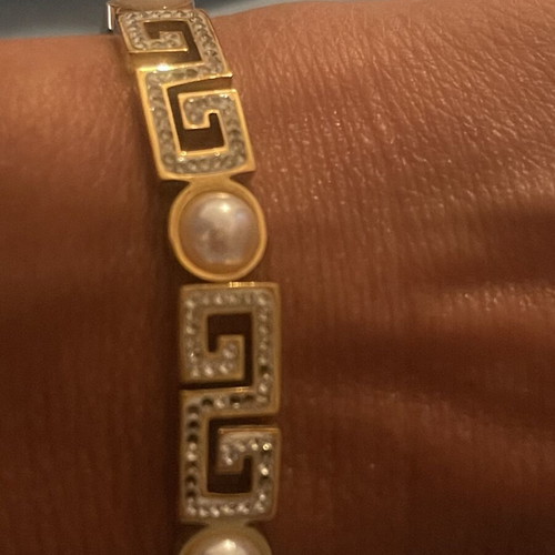 Steel bracelet used, gold color with meander design, crystals and pearls