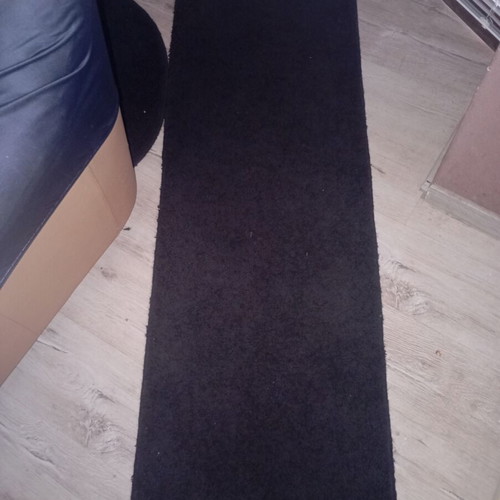 Black interior vintage runner rug used, minimalist design
