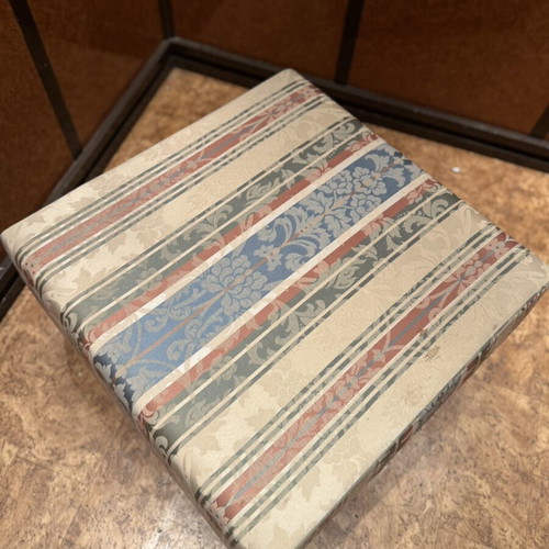 Vintage storage stool used with fabric design and wooden legs