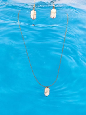 Handmade necklace with embossed white beads