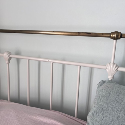 Double wrought iron bed with slats and used mattress