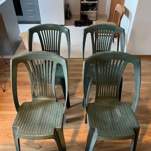 Set of 4 green plastic garden chairs