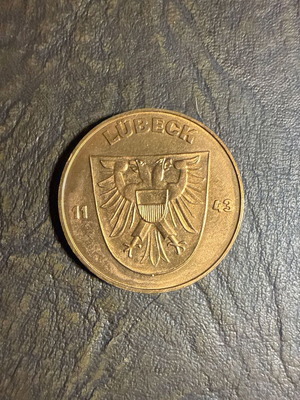 Collectible metal medal with embossed Holstentor design