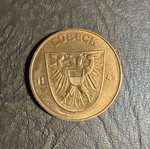 Collectible metal medal with embossed Holstentor design