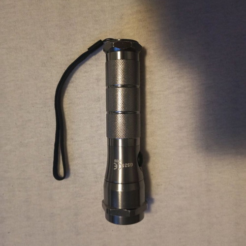 Led metal flashlight used
