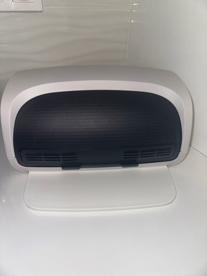 Tupperware bread box new with cutting tray