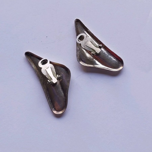 Silver earrings used with clip