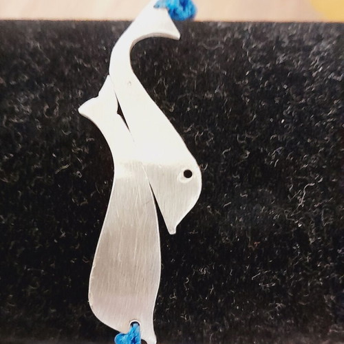 Handmade silver macrame bracelet with silver dolphins and colorfast threads