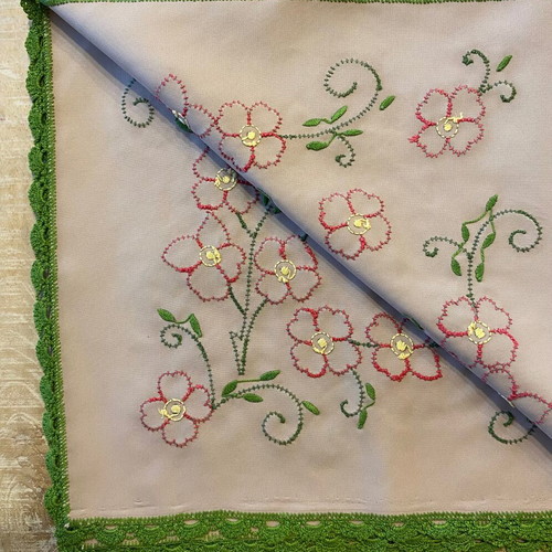 Handmade table linen with embroidery and lace used
