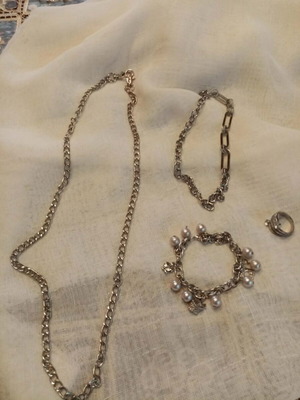 Chain set with bracelet and ring used, silver color