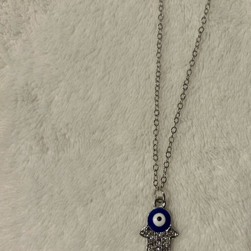 Handmade eye necklace in palm new