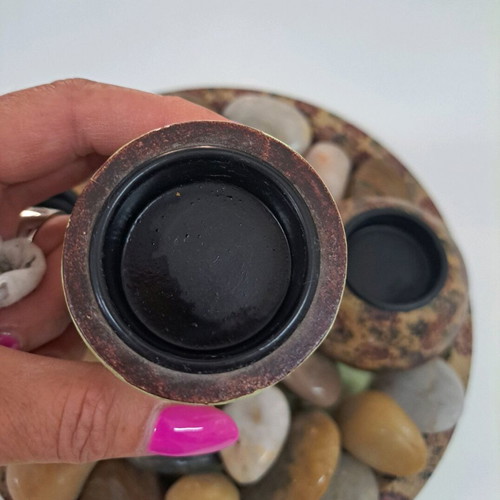 Tray with wooden candlesticks and colorful stones like new