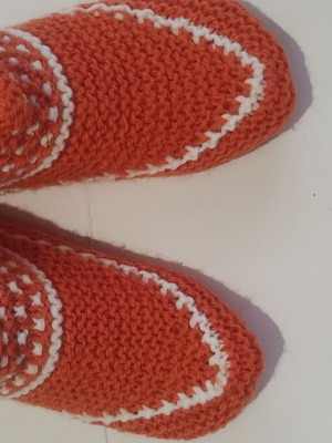 Orange slippers with white pattern