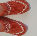 Orange slippers with white pattern
