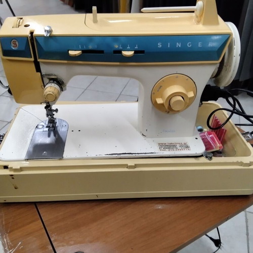 Singer sewing machine used, portable with frame damages