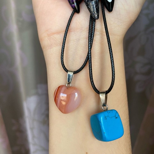 Pack of two crystal necklaces new with black cord unisex