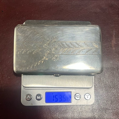 Silver cigarette case used with red stone and gold plating