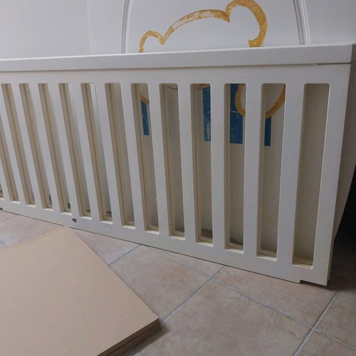 Baby cot used with accessories and fresh sheets