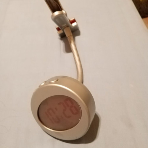 Office lamp with articulated spring and spiral clock