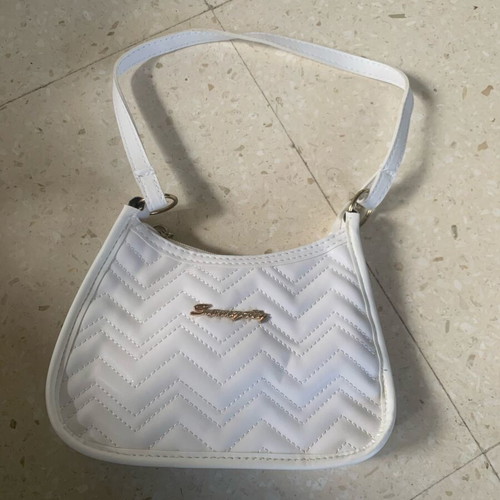 White quilted purse with gold hardware and extra long strap