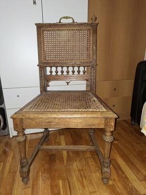 Vintage chair used with cane seat and carved details