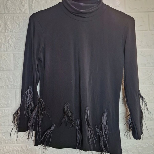 Turtleneck blouse with feathers like new