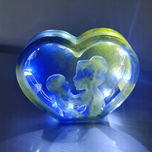 Decorative liquid glass piece like new, blue-yellow with lights