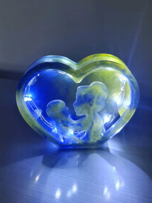 Decorative liquid glass piece like new, blue-yellow with lights