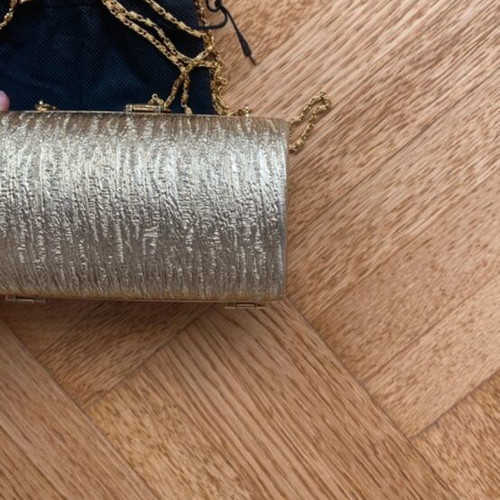 Gold clutch bag with chain strap