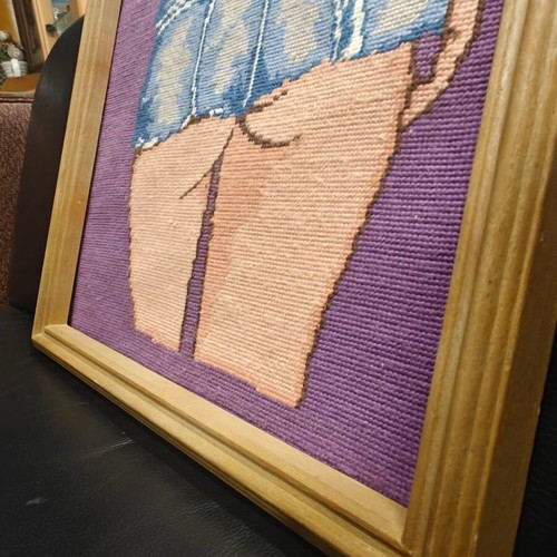 Framed gobelin woman in short denim shorts on purple background used