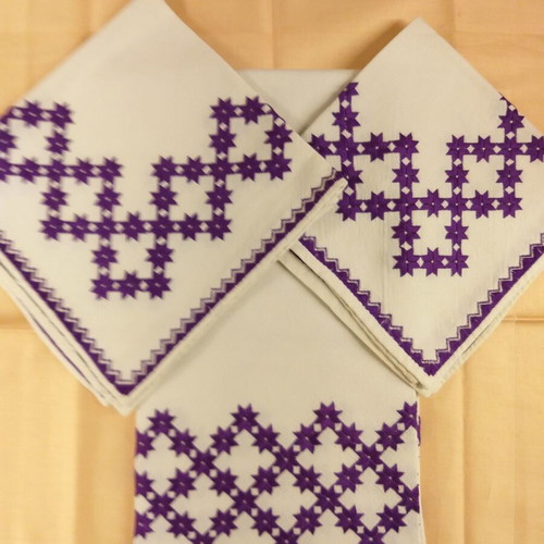 Handicrafts used, set of three table linens with purple star pattern