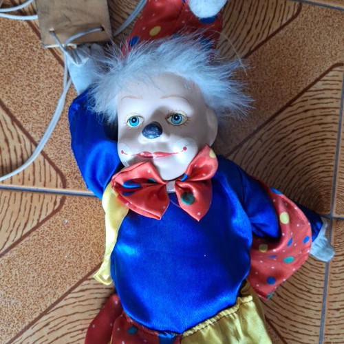 Porcelain puppet theater clown doll