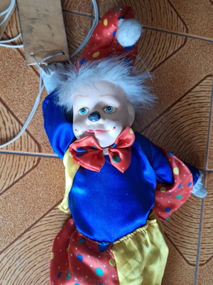 Porcelain puppet theater clown doll
