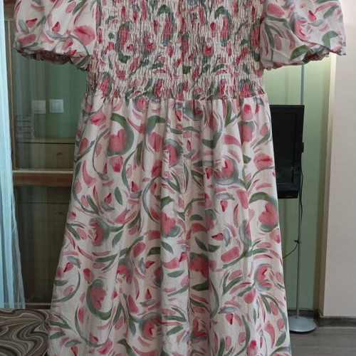 Long boho dress with floral print and smocked bodice