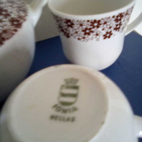 Tea set used with teapot, sugar bowl, creamer and two cups Ionian porcelain