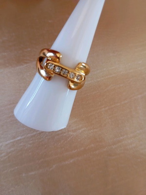 Gold ring with white zirconia opening, new