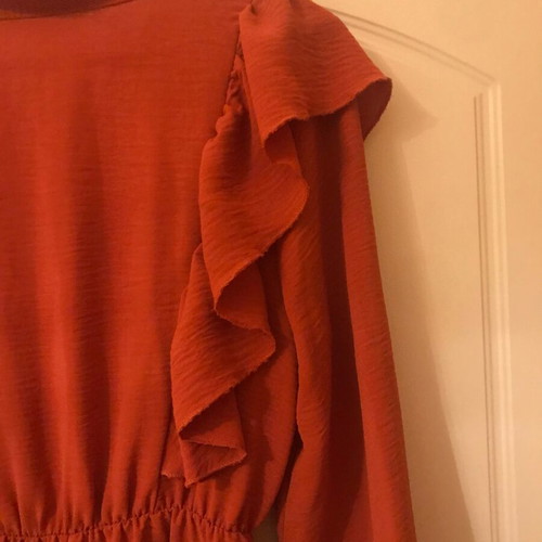 Coral dress like new with ruffles and front frill