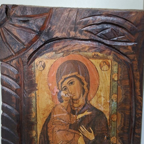 Panagia I Glykofilousa icon on wood used with carved decoration