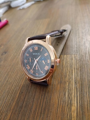 Men's watch new with tan strap and stainless steel