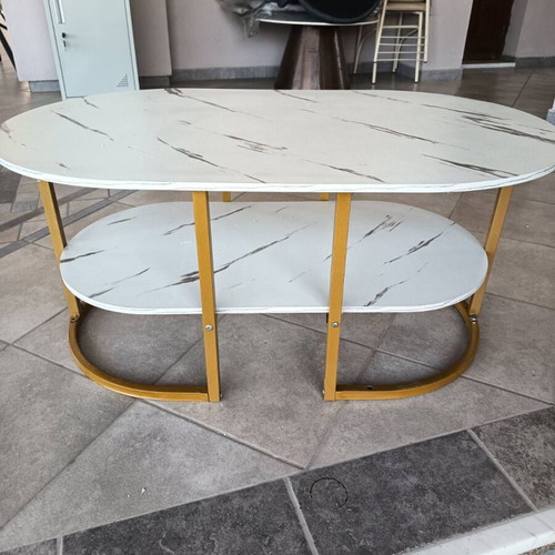 Oval coffee table with marble effect